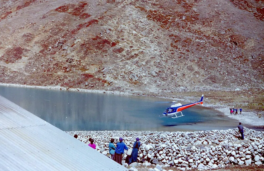 A rescue helicopter on the ice at Gokyo in the Nepal Himalaya, 22 June 2012.