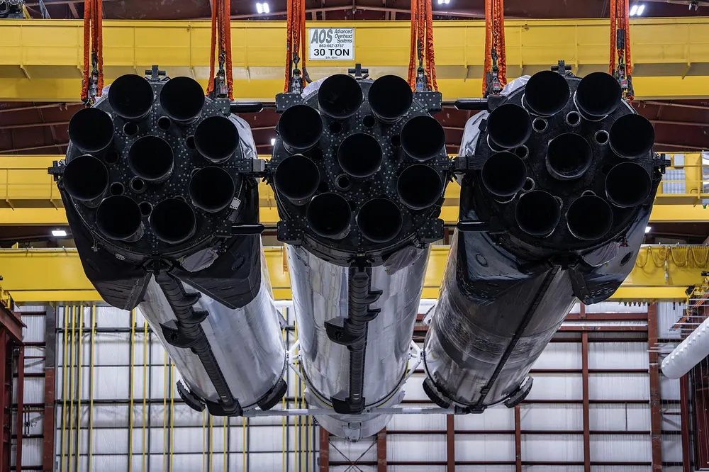Teams lift the SpaceX Falcon Heavy that will launch NASA's Nancy Grace Roman Space Telescope inside the hangar at Launch Complex 39A, Kennedy Space Center, Florida, 26 August 2026.