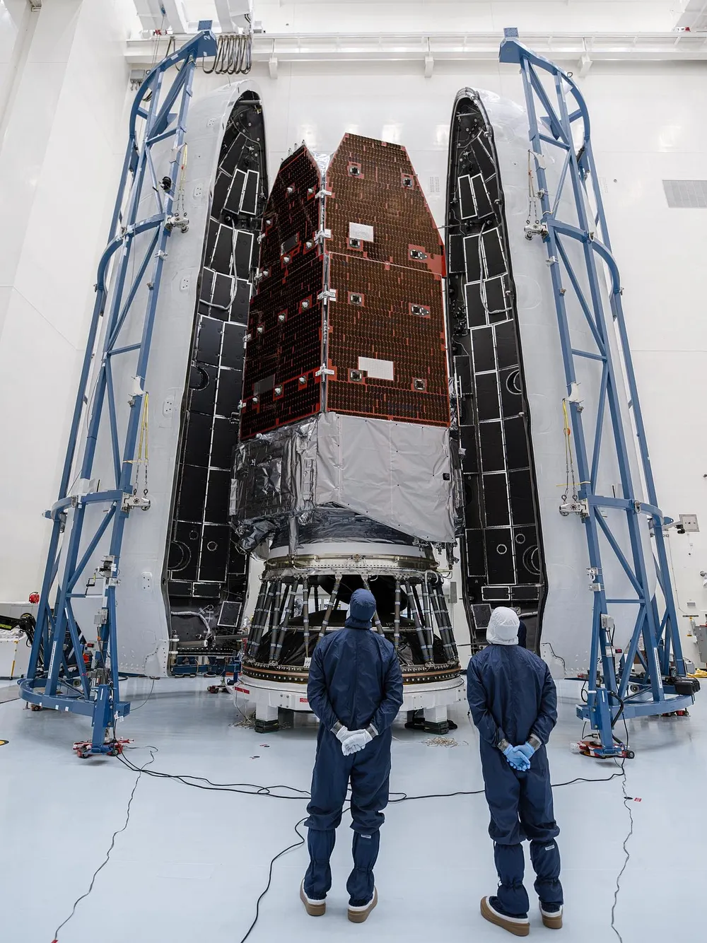 Teams inside the Payload Hazardous Servicing Facility at Kennedy Space Center encapsulate the Nancy Grace Roman Space Telescope in its payload fairing, 21 August 2026.