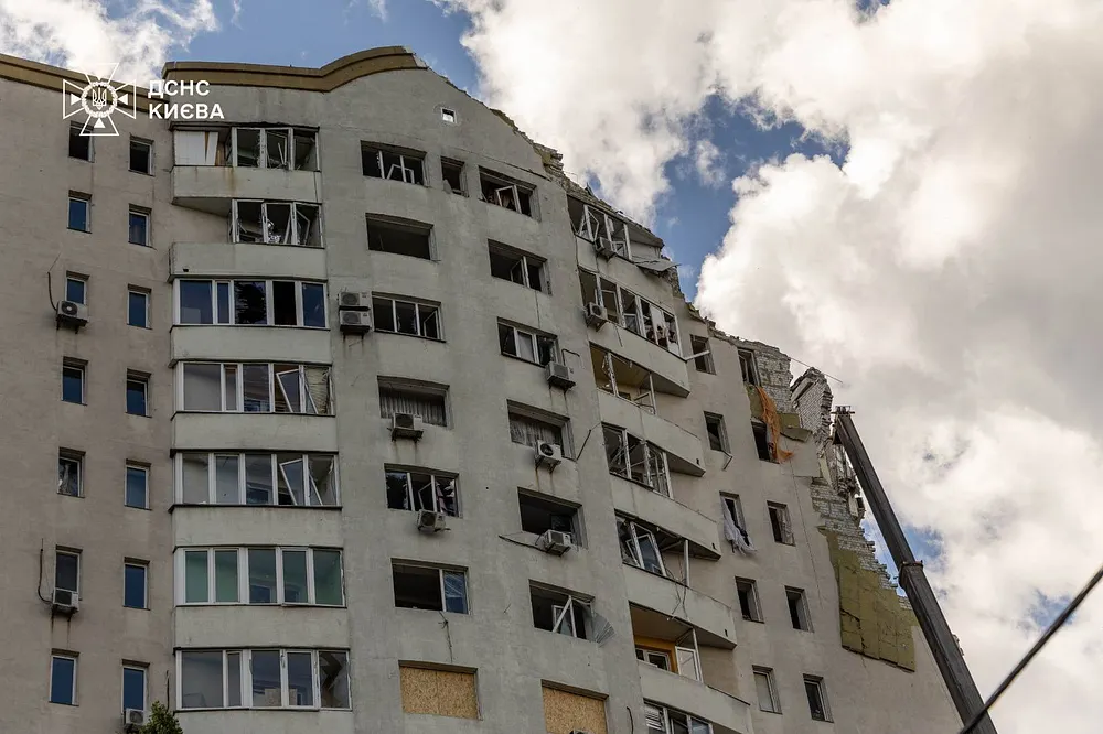 Ukrainian emergency crews work at a 16-storey residential building hit in Kyiv's Darnytskyi district, 2 July 2026.