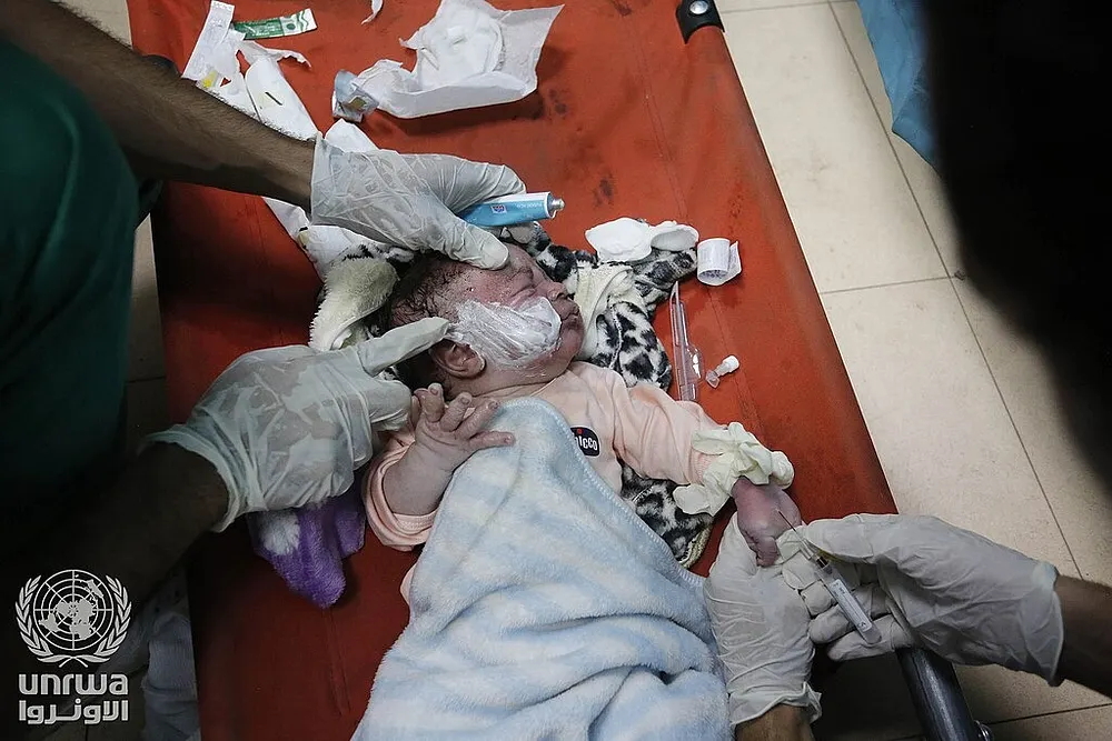 Palestinians injured by an Israeli airstrike in Deir el-Balah, Gaza Strip, 16 November 2023.