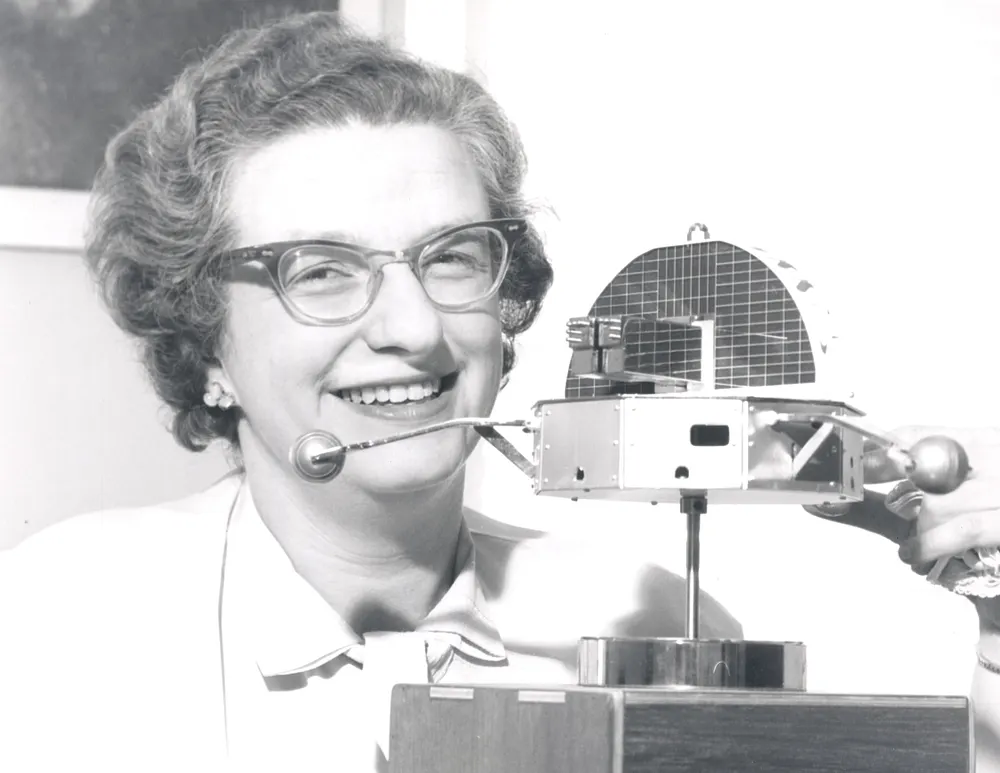 NASA astronomer Nancy Grace Roman with a model of the Orbiting Solar Observatory.