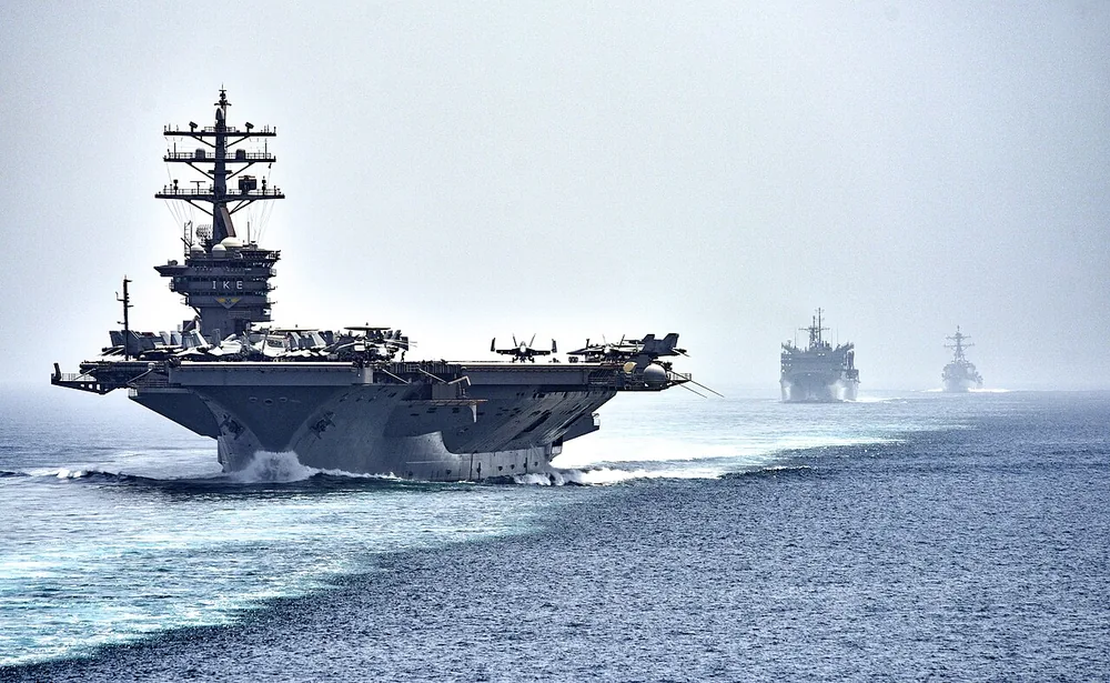 The aircraft carrier USS Dwight D. Eisenhower (CVN 69), followed by USNS Arctic and USS Nitze (DDG 94), transits the Strait of Hormuz on 21 July 2016.