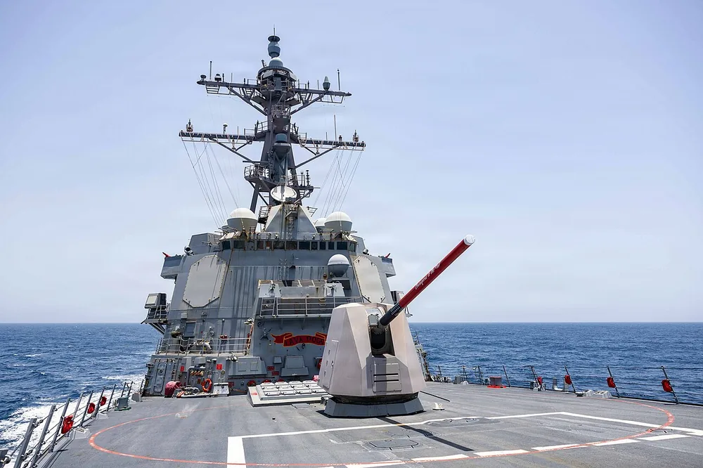 The Arleigh Burke-class guided-missile destroyer USS Rafael Peralta (DDG 115) patrols the Arabian Sea enforcing a maritime blockade against ships entering or exiting Iranian ports, 18 May 2026.
