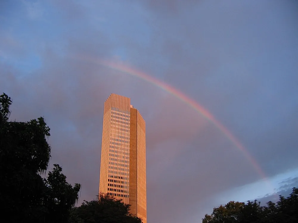 The Eurotower in Frankfurt am Main, former home of the European Central Bank, under a rainbow.