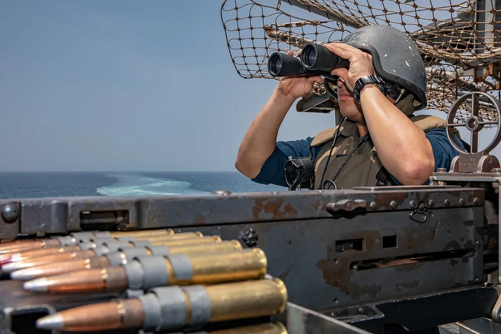 A Sailor stands watch aboard a Wasp-class amphibious assault ship in the Bab al-Mandeb Strait on 8 June 2019.