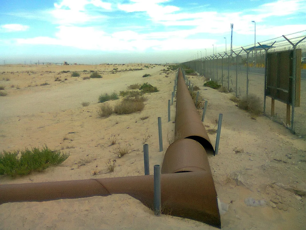 Oil pipelines crossing the desert near Jubail, Saudi Arabia.