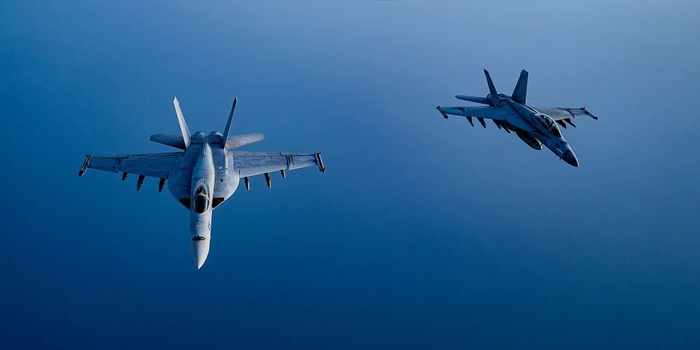 U.S. Air Force F/A-18 Super Hornets fly over the Red Sea.