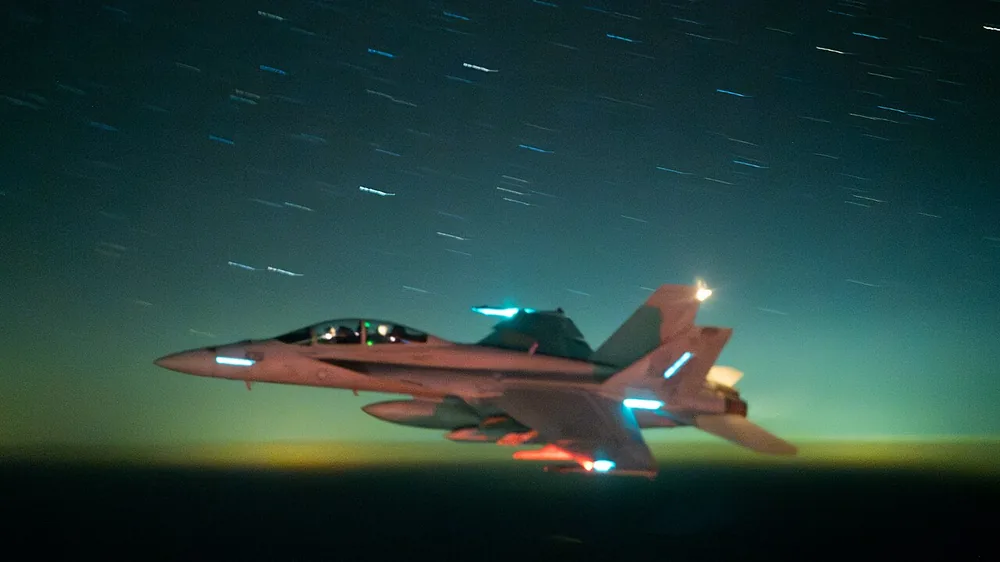 A U.S. Navy F/A-18 Super Hornet flies over the Red Sea on 23 March 2025.