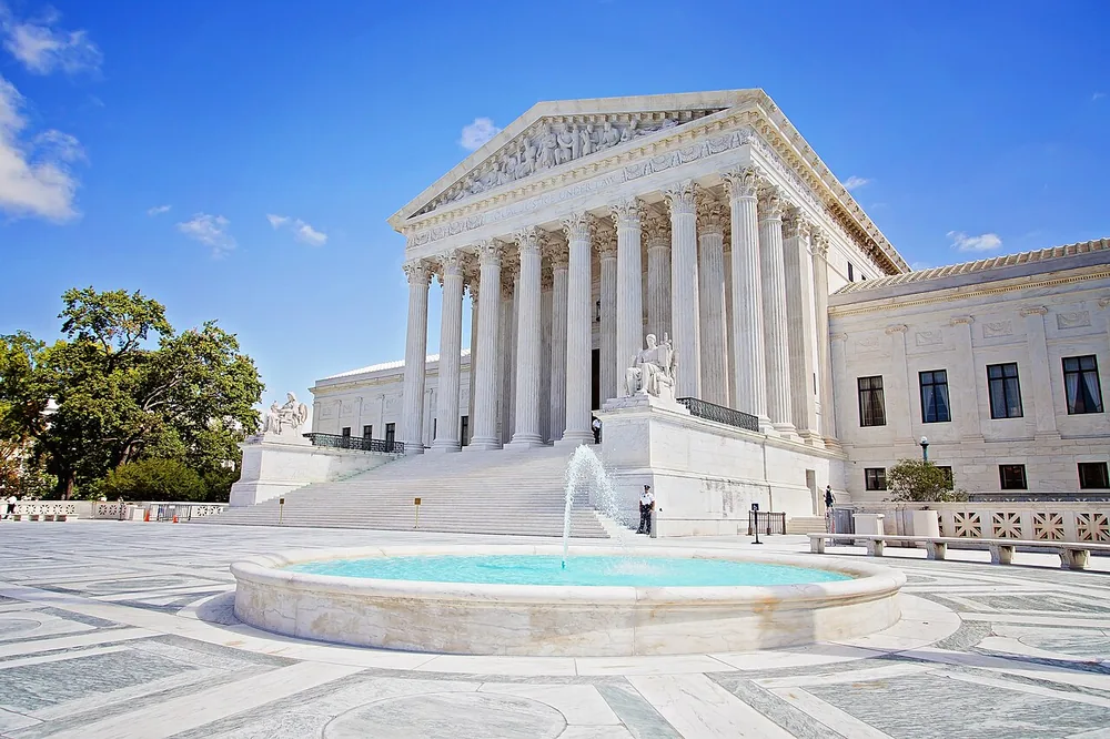 The United States Supreme Court Building on a clear day.