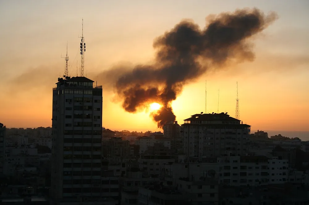 Sunset over Gaza City with smoke on the skyline, 6 January 2009.
