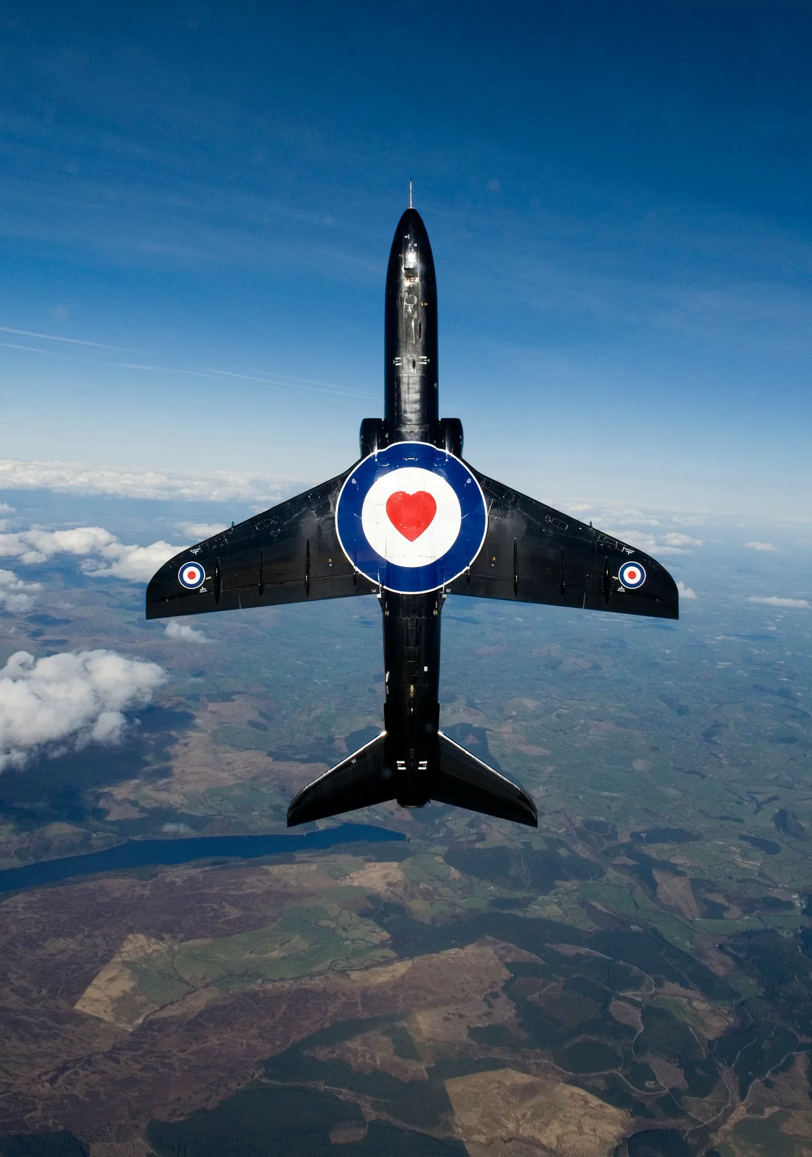 A Hawk T1 training jet high above RAF Valley, Anglesey.