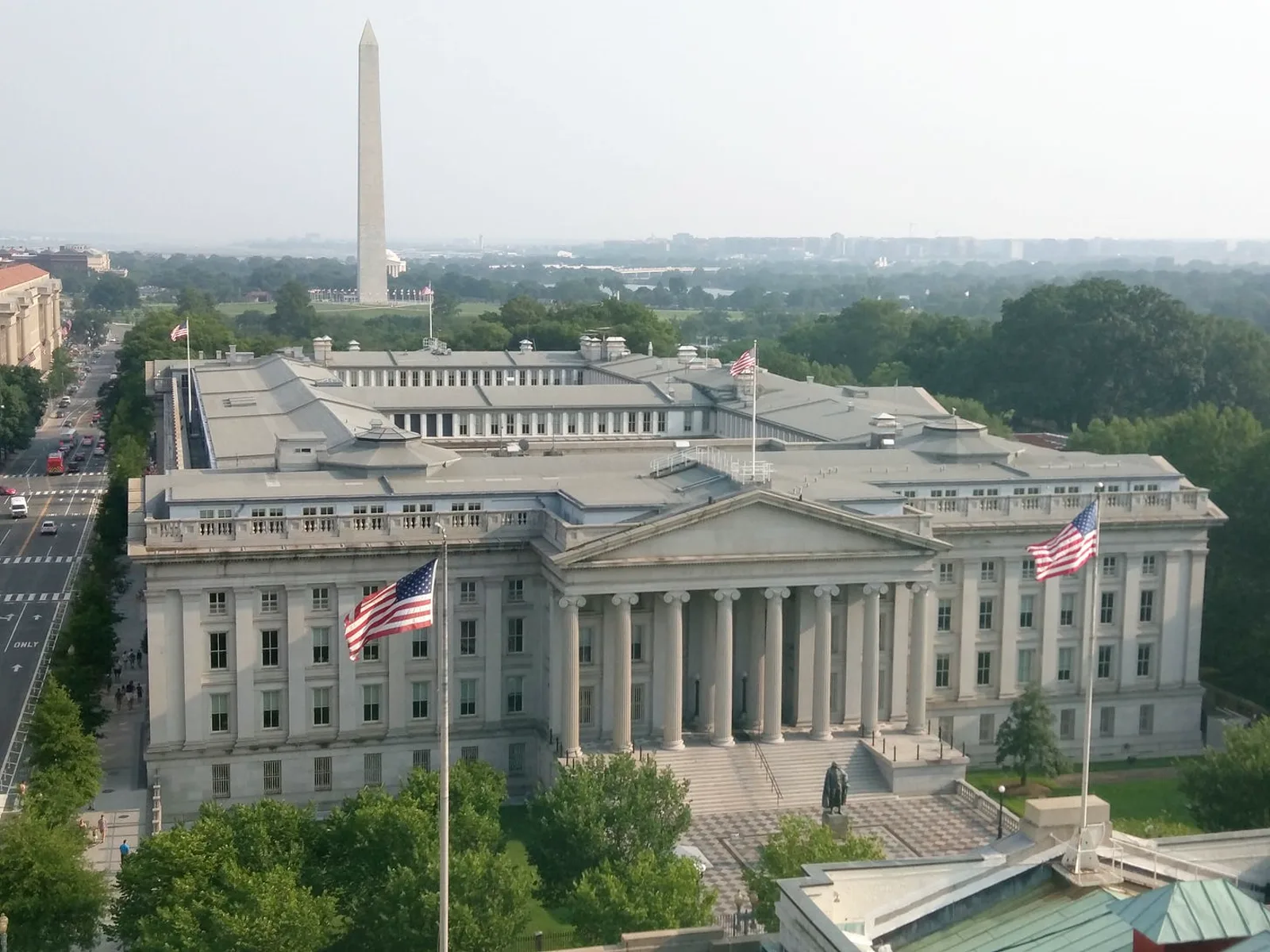 The US Treasury Building in Washington, D.C., with the Washington Monument behind, 2015.